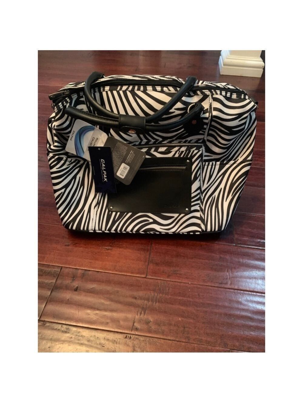 Women's CALPAK Rolling Duffel Bag Zebra Print Carry-On - Picture 2 of 6